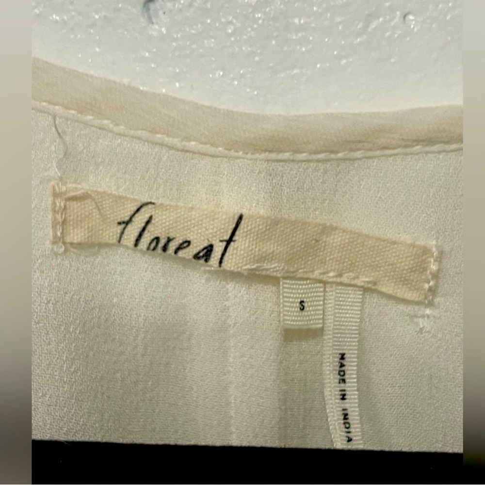 Floreat shear wrap top in cream.